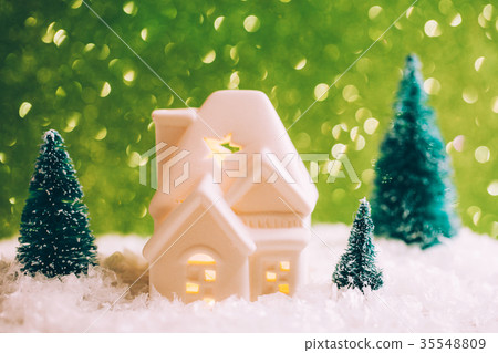 Little toy house with three pines 35548809