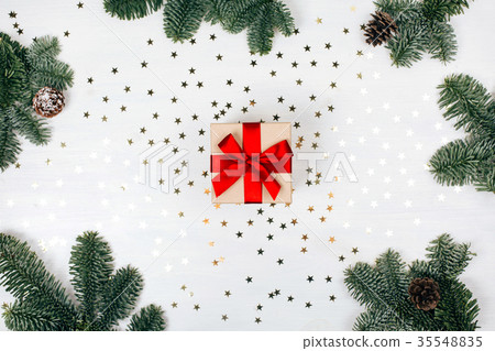 Christmas present with red ribbon 35548835