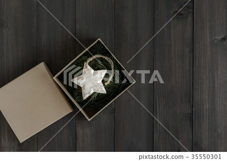 Wooden star ornament with fir tree branch 35550301