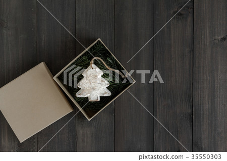 Wooden tree ornament with fir tree branch Wooden tree ornament with fir tree branch 35550303