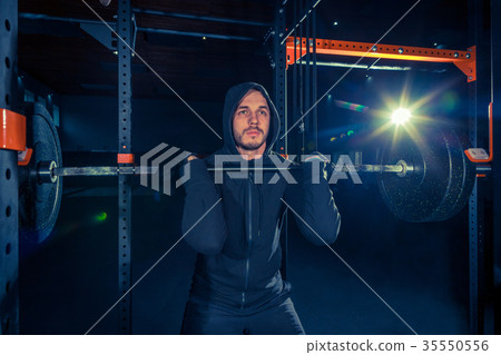Portrait of super fit muscular young man working Portrait of super fit muscular young man working 35550556