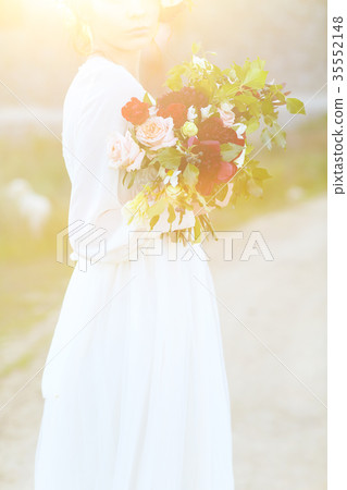 Beautiful bride with wedding bouquet Beautiful bride with wedding bouquet 35552148