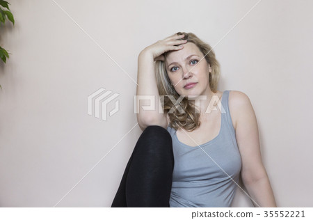 Portrait of middle age woman in the room 35552221