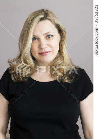 Portrait of middle age woman in the room 35552222
