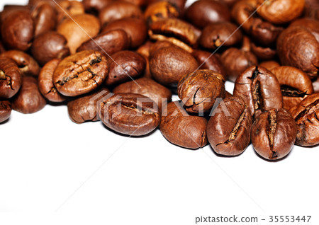 Coffee Grains fried on a white background. Macro 35553447