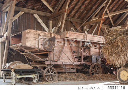 ancient wooden harvester in a farm ancient wooden harvester in a farm 35554436