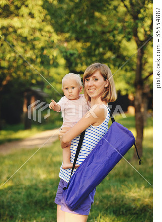 Mother and her daugther going for yoga class 35554882