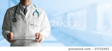 Male Doctor Holding Tablet Computer 35556465