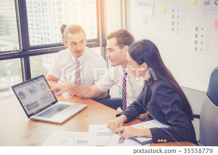 Business team having a meeting using laptop 35558779