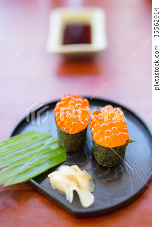 Sushi with caviar on a black plate with ginger Sushi with caviar on a black plate with ginger 35562914