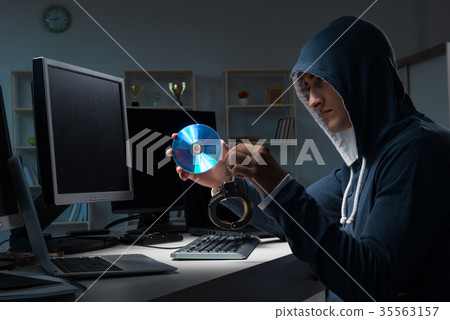 Hacker hacking computer at night 35563157