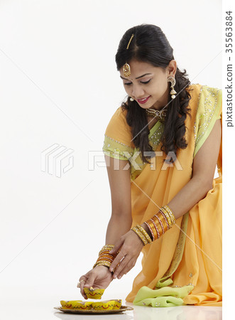 Beautiful Indian woman celebrating Diwali Beautiful Indian woman celebrating Diwali 35563884
