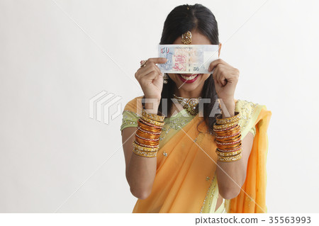 indian woman holing cash 35563993