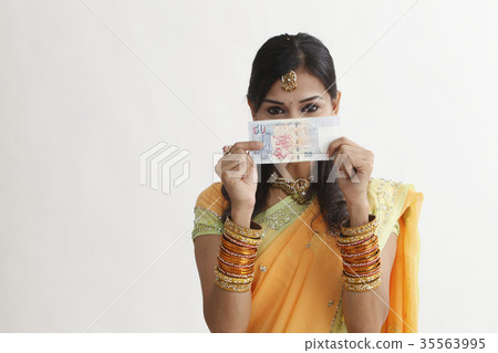 indian woman holing cash 35563995