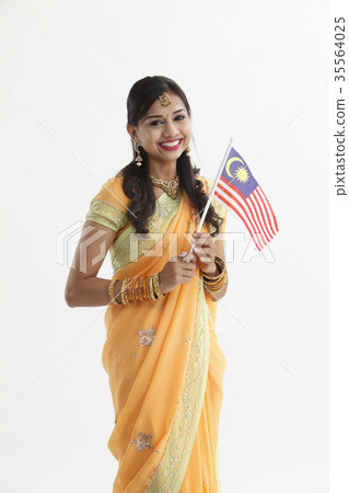 Indian woman in traditional clothing holding flag 35564025