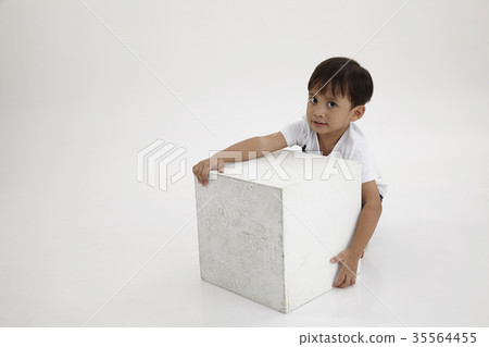 boy lifting a box boy lifting a box 35564455