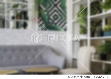 Blurred room ambiance with sofa and plant pot Blurred room ambiance with sofa and plant pot 35565797