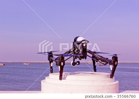 Professional camera drone and ocean. Professional camera drone and ocean. 35566760