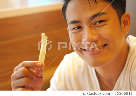man eating french fries, fried fast food 35566811