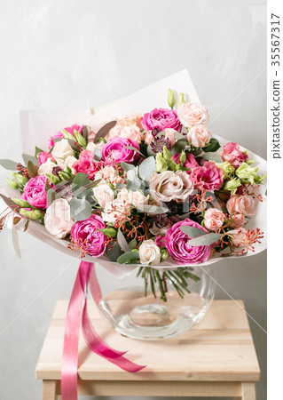 beautiful bouquet of mixed flowers into a vase on beautiful bouquet of mixed flowers into a vase on 35567317
