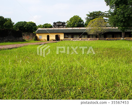 Ancient building view in green grass yard area 35567453