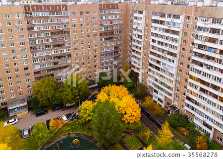 Yard of multi-storey apartment house in autumn in Yard of multi-storey apartment house in autumn in 35568278