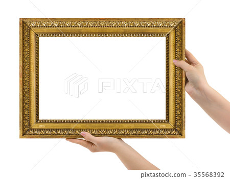 Wooden picture frame in hands 35568392