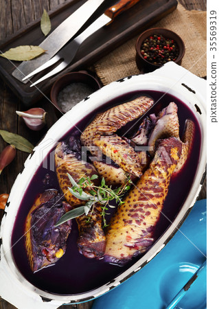 a raw rooster marinated in red wine a raw rooster marinated in red wine 35569319