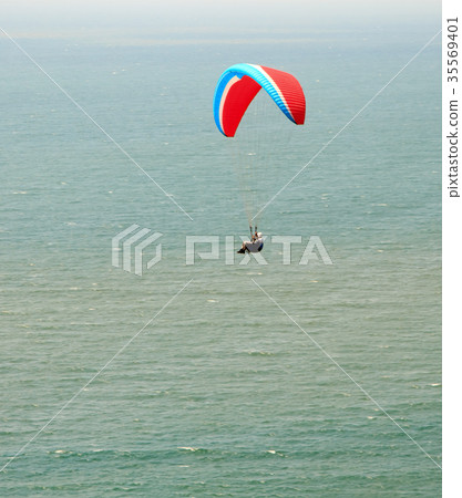 Paraplane flight. Paraplane flight over the sea Paraplane flight. Paraplane flight over the sea 35569401