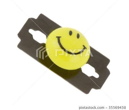 Smile face on the blade isolated over white Smile face on the blade isolated over white 35569438