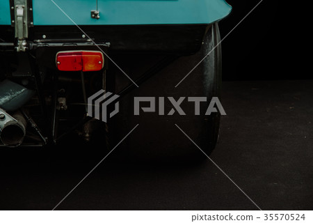 Close up on sport race car tire on the track 35570524