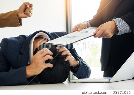 Group Of Angry Business people Blaming Male Colleague In Meeting 35571055