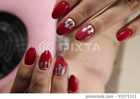 Red manicure design with silver 35571311