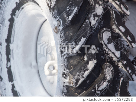 tractor wheel in the snow 35572298