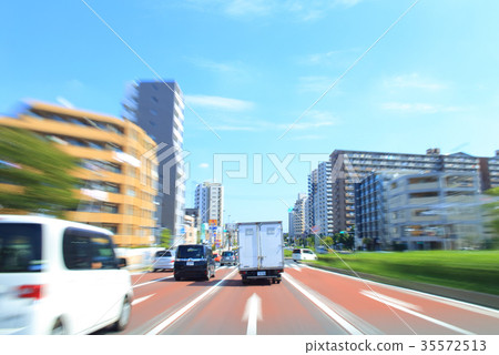 Trucks and cars traveling on Tokyo's main roads 35572513