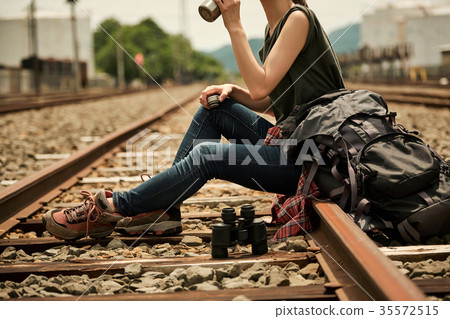 Woman backpacker going to the railway Woman backpacker going to the railway 35572515