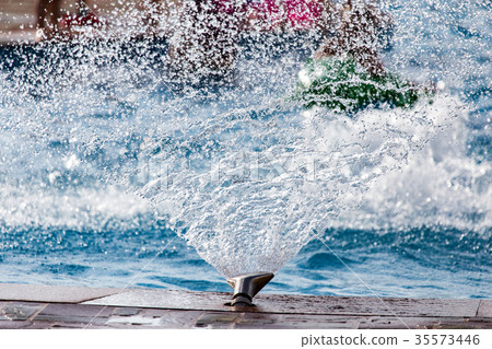 Splashing water in the pool as a background Splashing water in the pool as a background 35573446