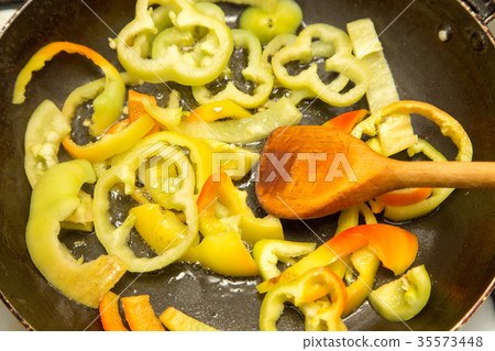 paprika fried on a frying pan 35573448