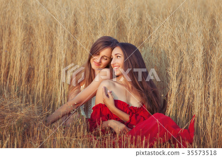 Women in love are flirting. 35573518