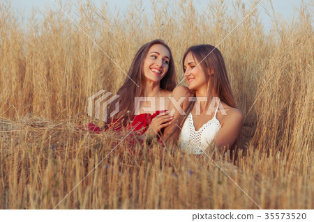 Smiling women are in love. 35573520