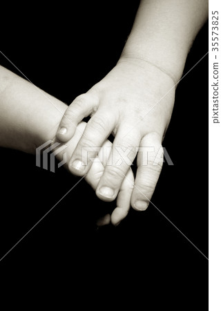 sister holding brothers hand 35573825
