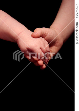 sister holding brothers hand 35573826