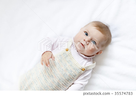 Portrait of cute baby girl wearing vintage clothes Portrait of cute baby girl wearing vintage clothes 35574783