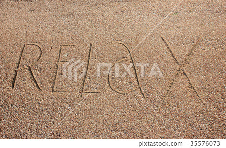 Relax text is written on sand 35576073
