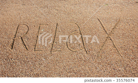 Relax text is written on sand 35576074