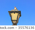 Old vintage metal street lamp and bird 35576136
