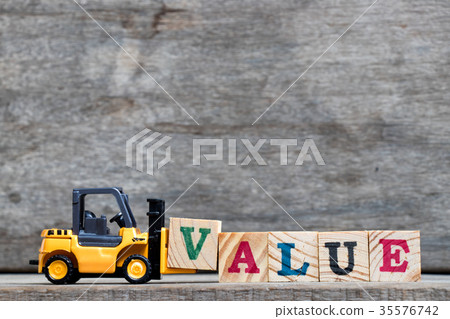 Yellow forklift hold letter V to complete value Yellow forklift hold letter V to complete value 35576742