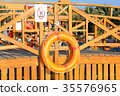 Orange lifebuoy handing 35576965