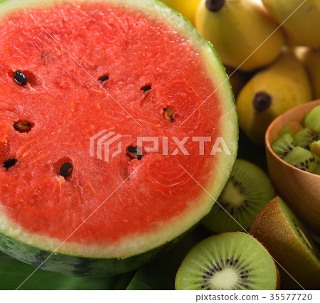 Water melon  on wooden table 35577720