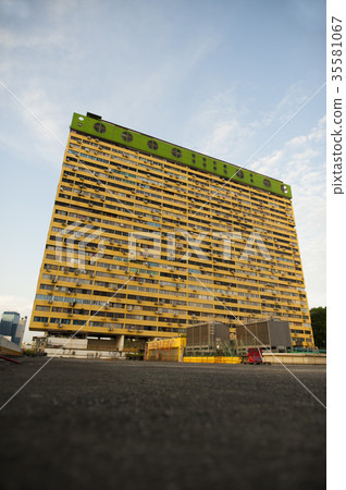 A view of a yellow building. A view of a yellow building. 35581067